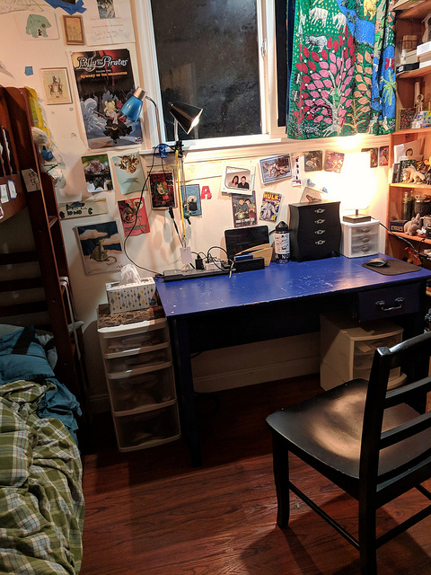 blue desk in a little room